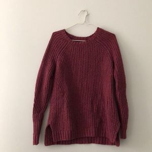 A very warm toned mauve sweater